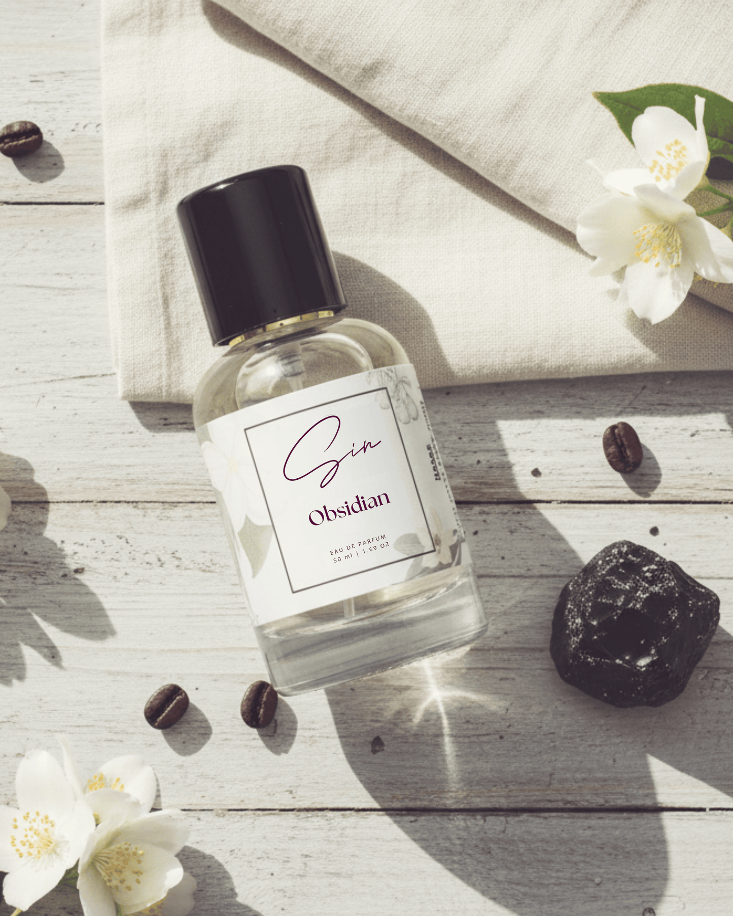 SIN Obsidian luxury perfume in India – pink pepper, coffee, and vanilla create a bold signature scent inspired by mystery, depth, and power.