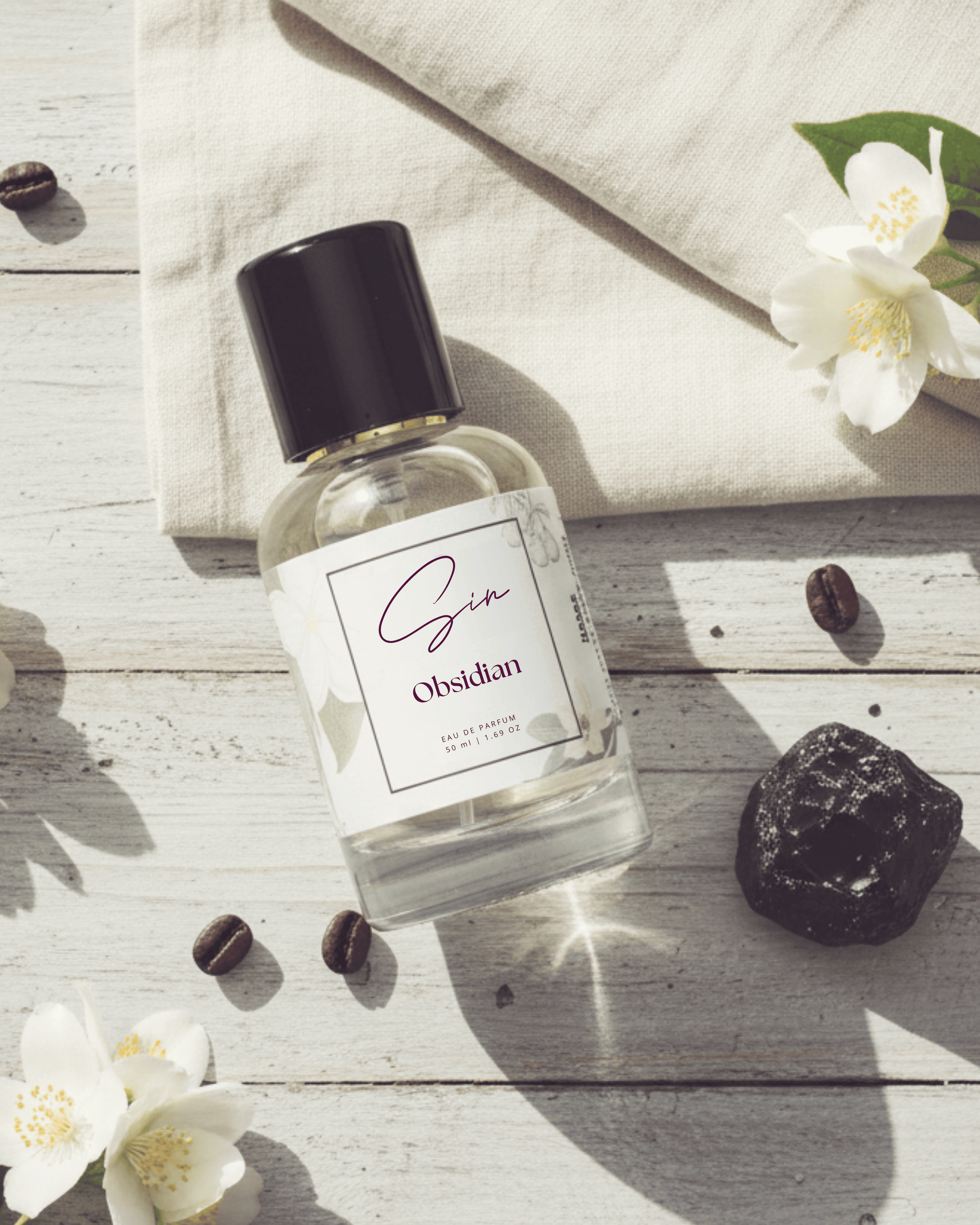 SIN Obsidian luxury perfume in India – pink pepper, coffee, and vanilla create a bold signature scent inspired by mystery, depth, and power.